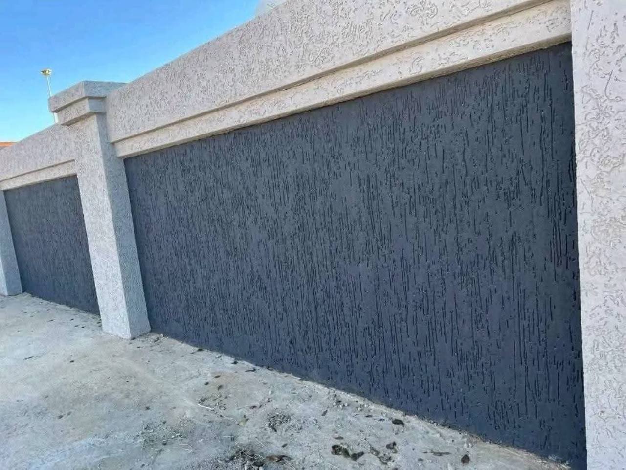 Charcoal Gamazine textured finish on an exterior boundary wall